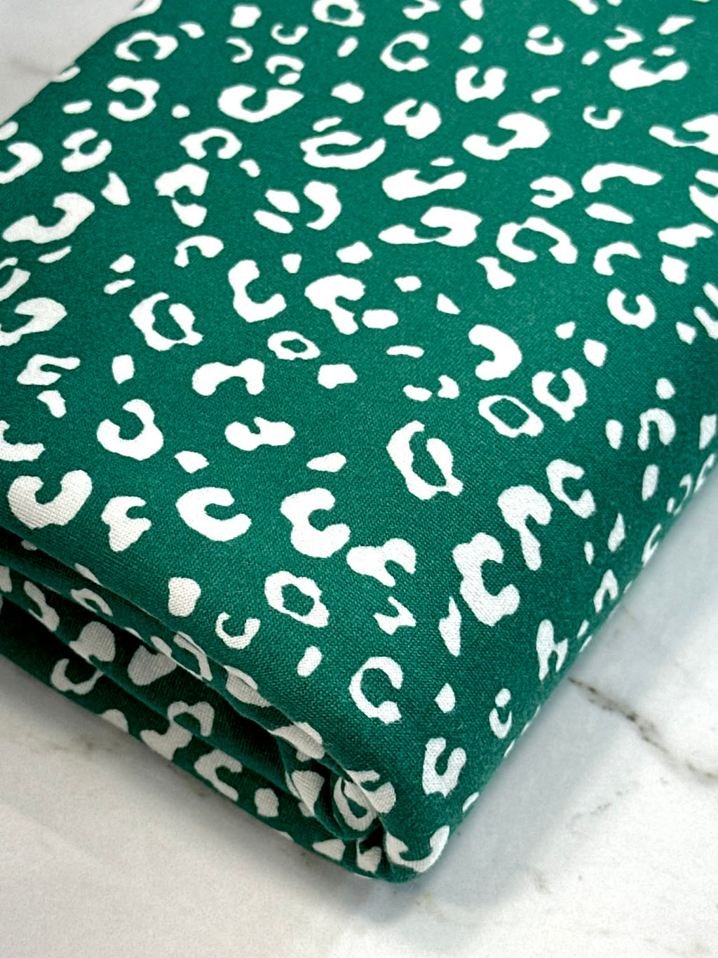 (DBP) TINY WHITE LEOPARD ON HUNTER GREEN