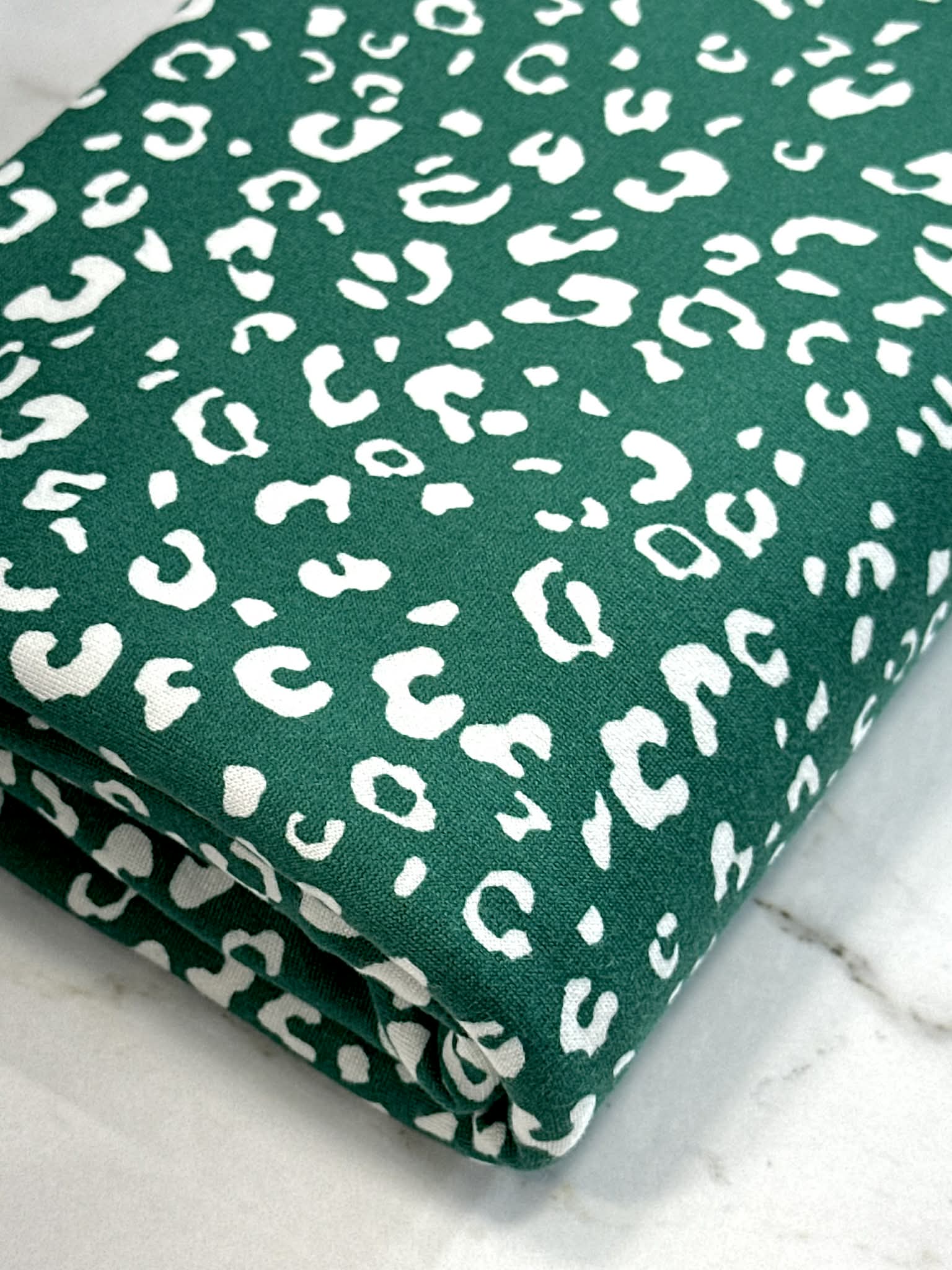 (DBP) TINY WHITE LEOPARD ON HUNTER GREEN
