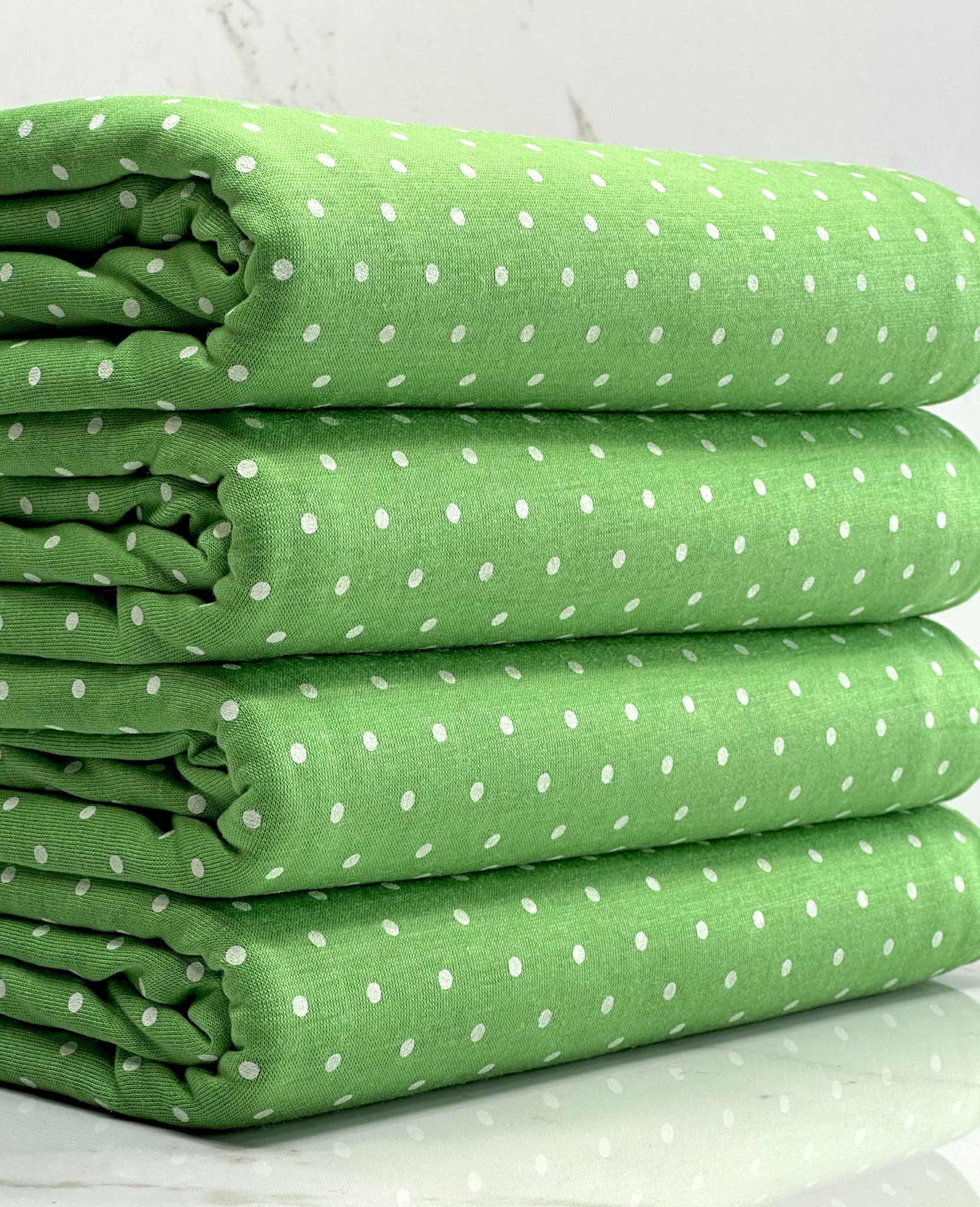 (KNIT) TINY OFF WHITE POLKA DOTS ON GREEN
