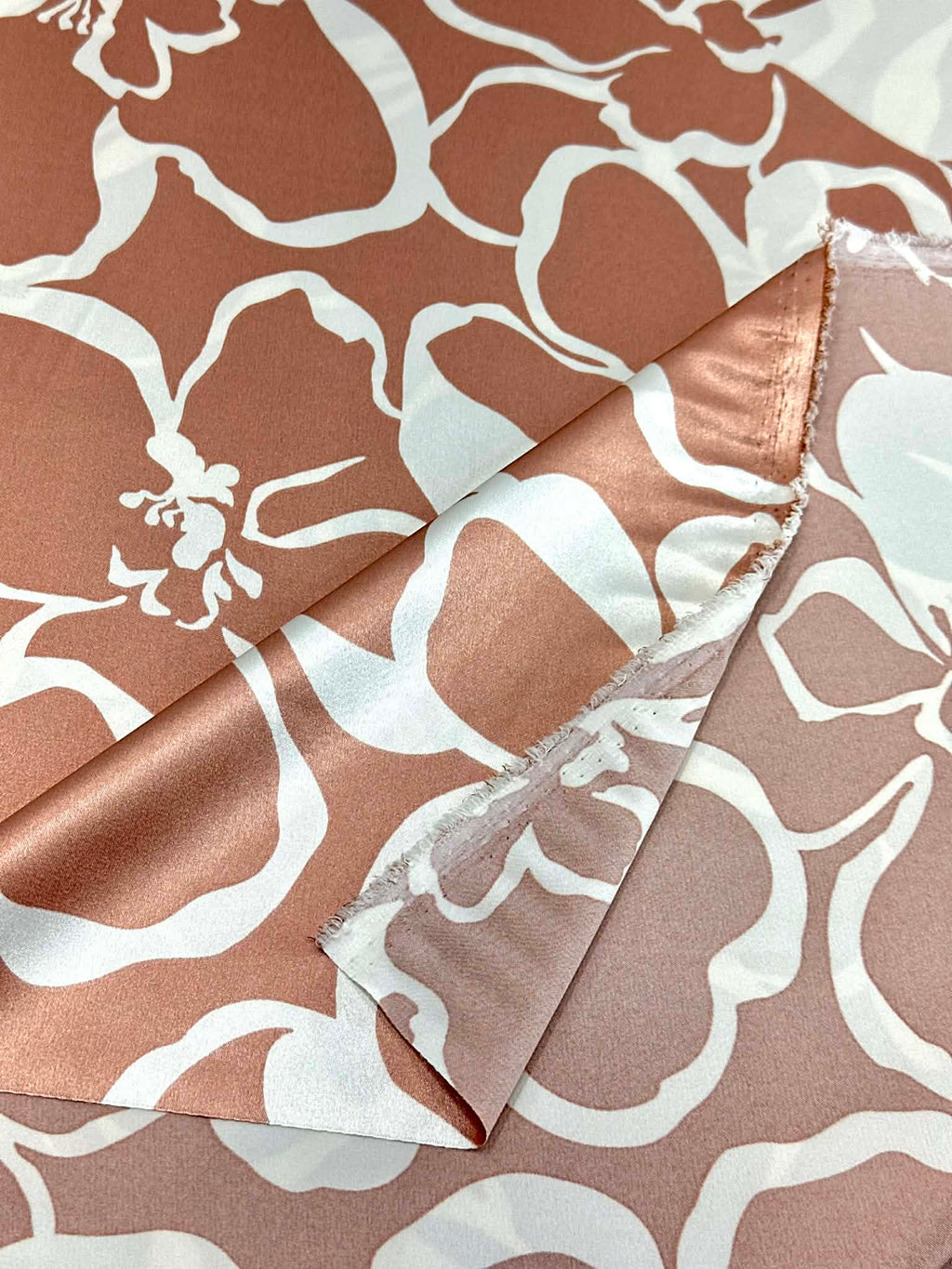 (SATIN) WHITE FLORAL ON MAUVE