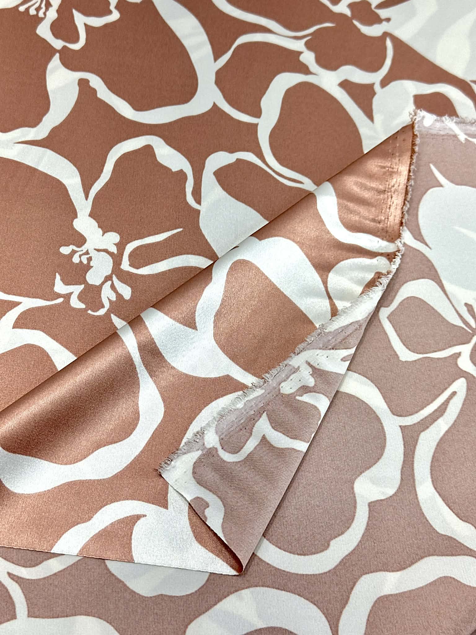 (SATIN) WHITE FLORAL ON MAUVE