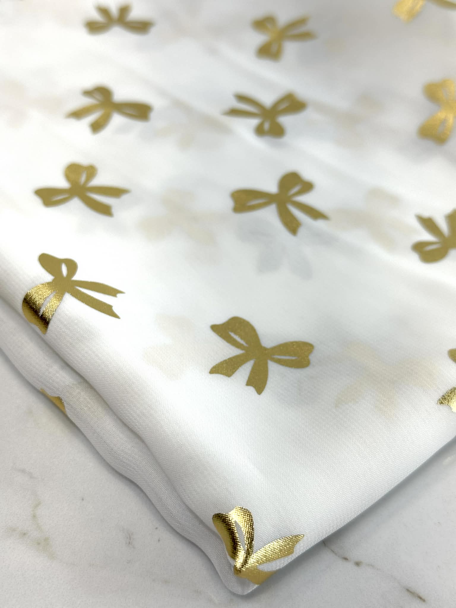 (WOVEN) GOLD BOWS ON OFF WHITE