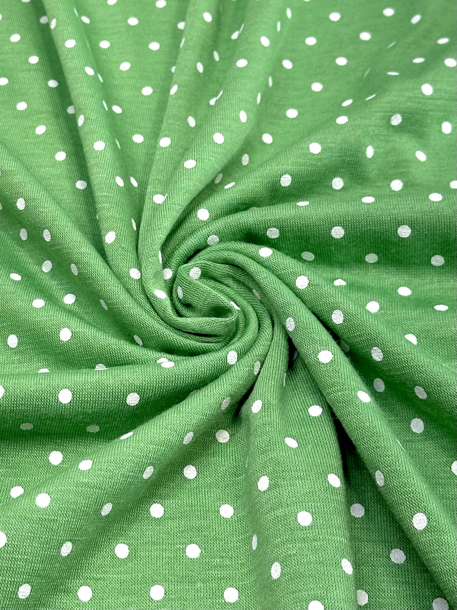 (KNIT) TINY OFF WHITE POLKA DOTS ON GREEN