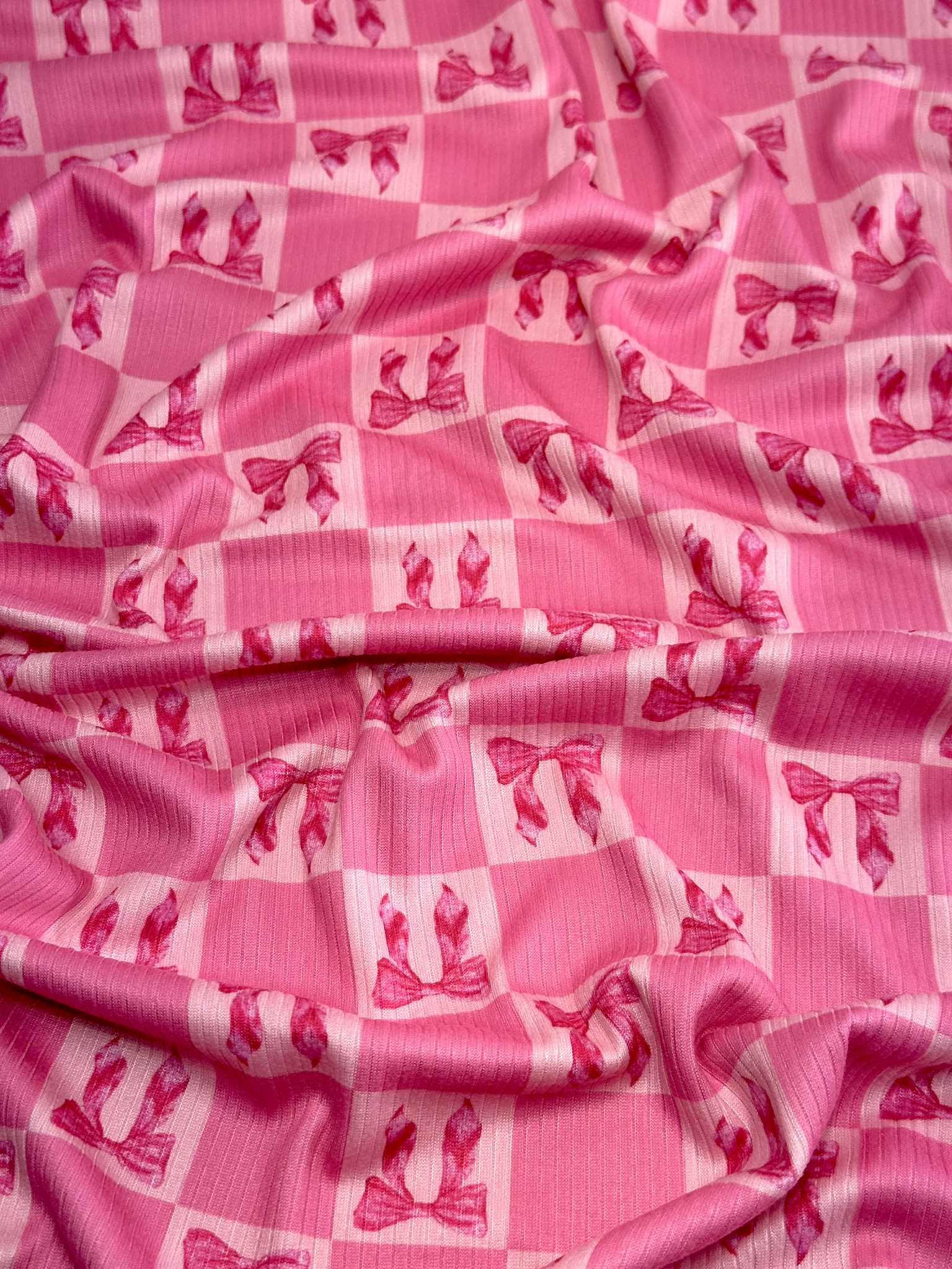 (4X2 RIB) HOT PINK BOWS ON PINK MEDIUM CHECKERED