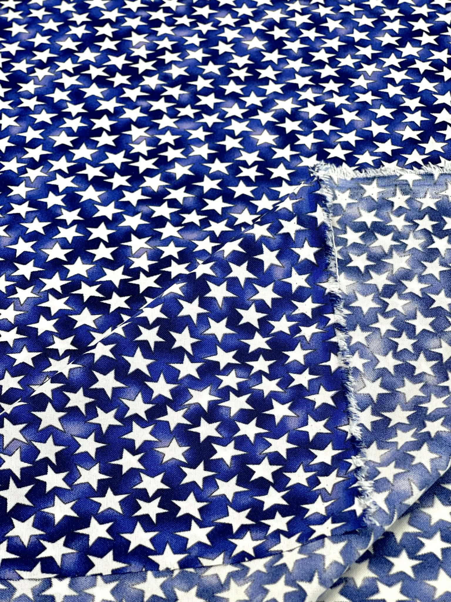 (COTTON) TINY WHITE STARS ON ROYAL BLUE