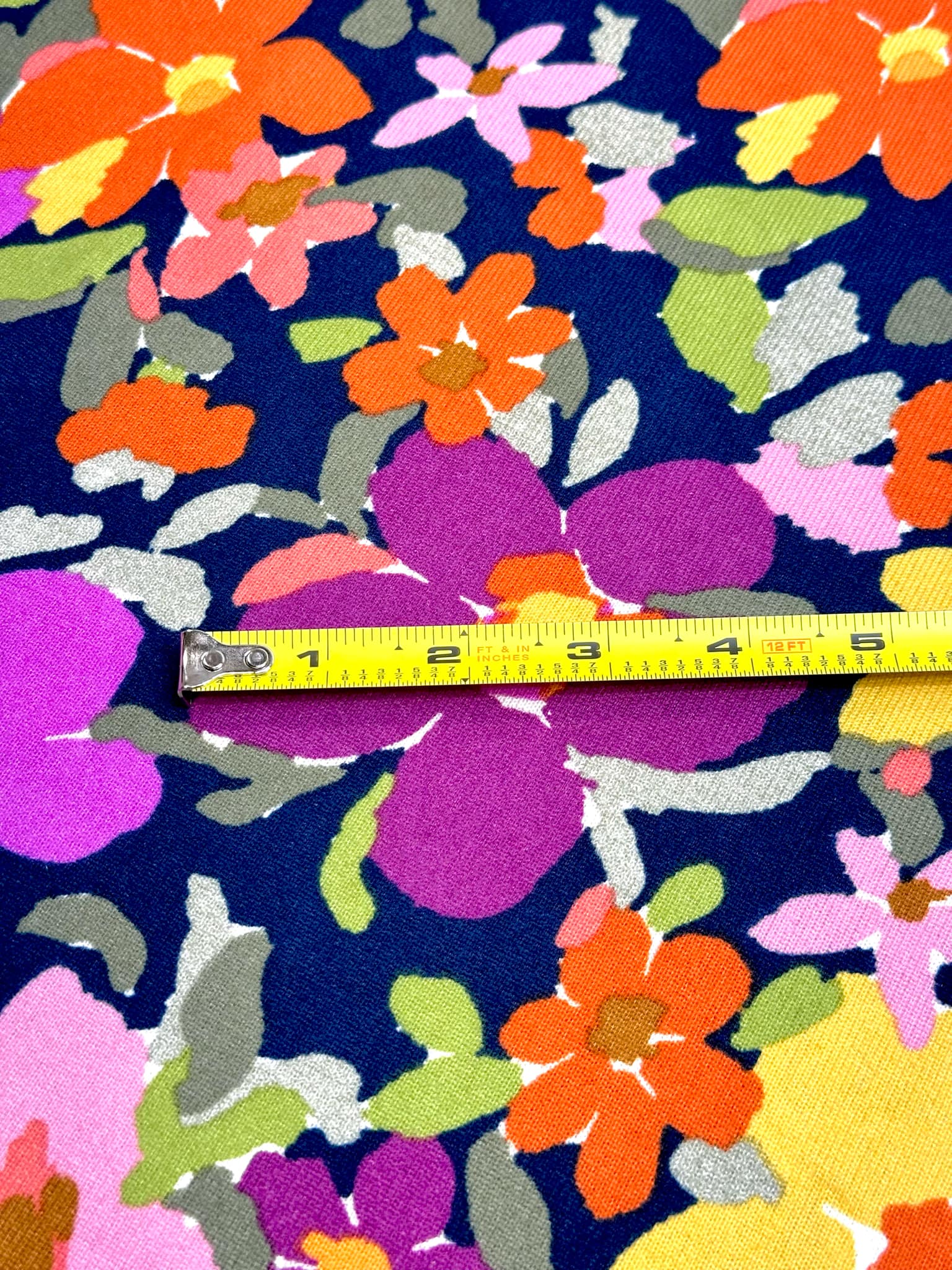 (SWEATER KNIT) PURPLE, ORANGE, YELLOW AND PINK FLOWERS ON NAVY