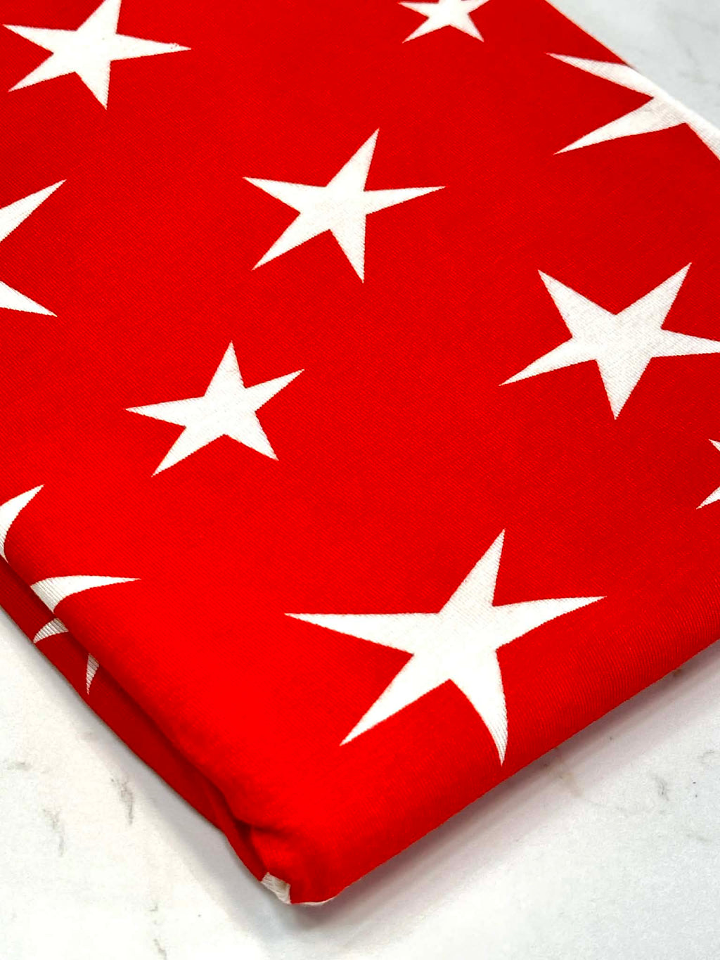 (RAYON  MODAL) OFF WHITE STARS ON RED