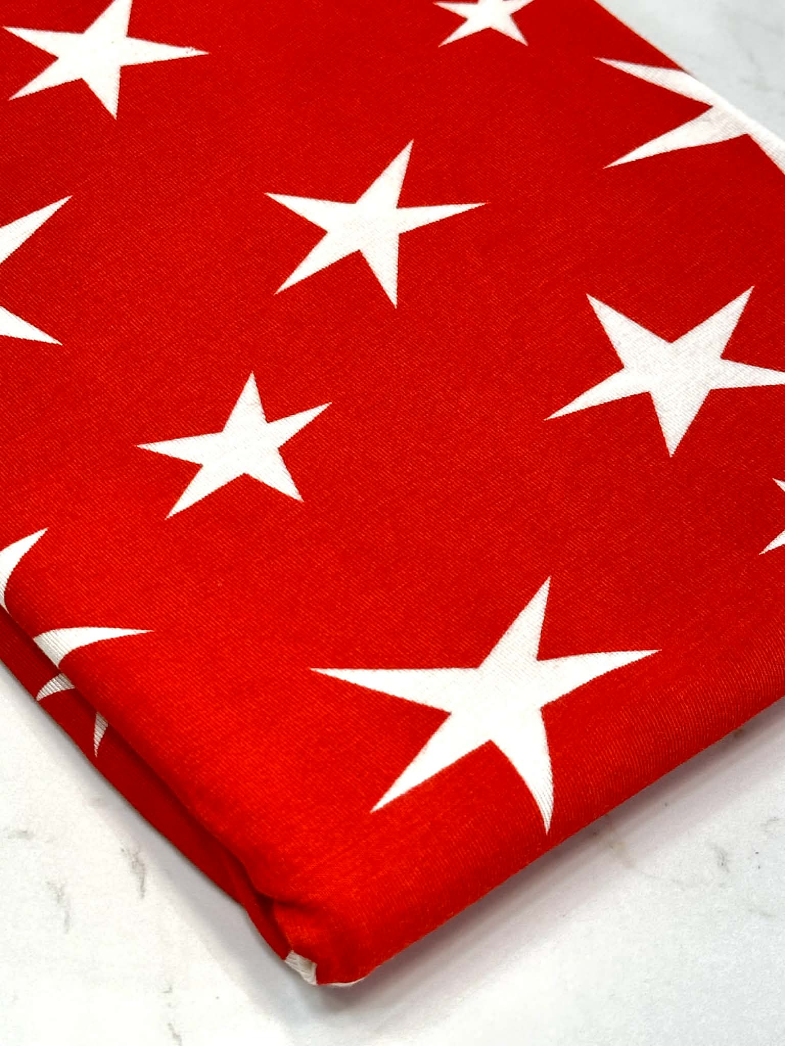 (RAYON  MODAL) OFF WHITE STARS ON RED