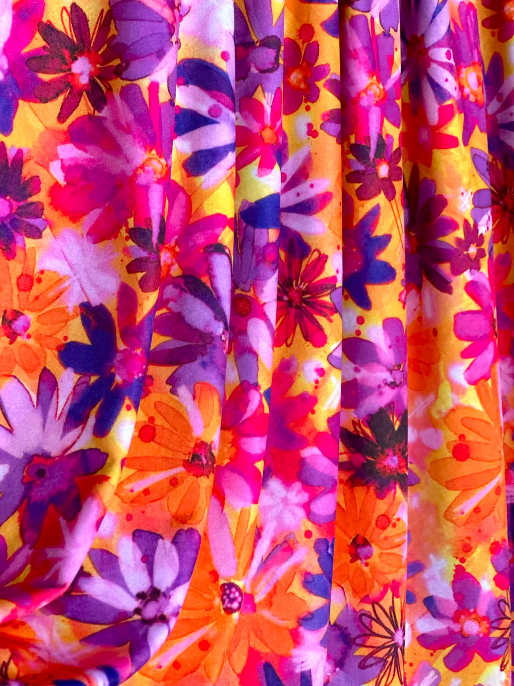 (ITY) PURPLE FLOWERS ON ORANGE