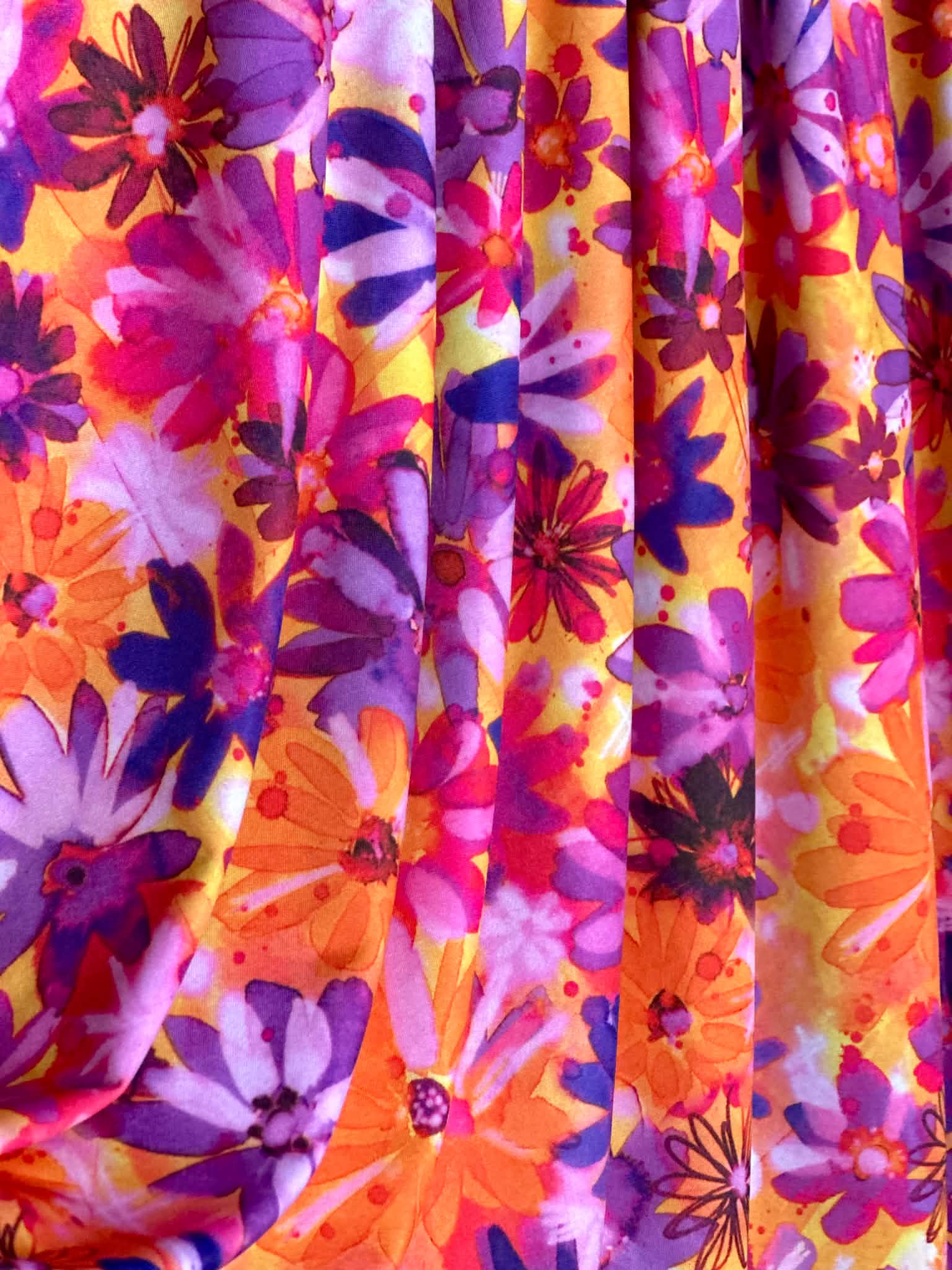 (ITY) PURPLE FLOWERS ON ORANGE