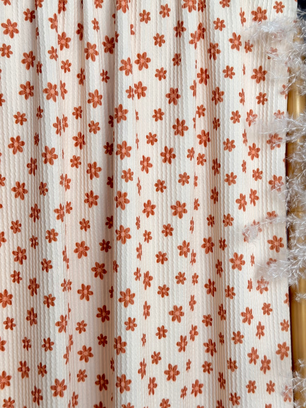 (URBAN RIB) TINY BURNT ORANGE FLOWERS ON CREAM