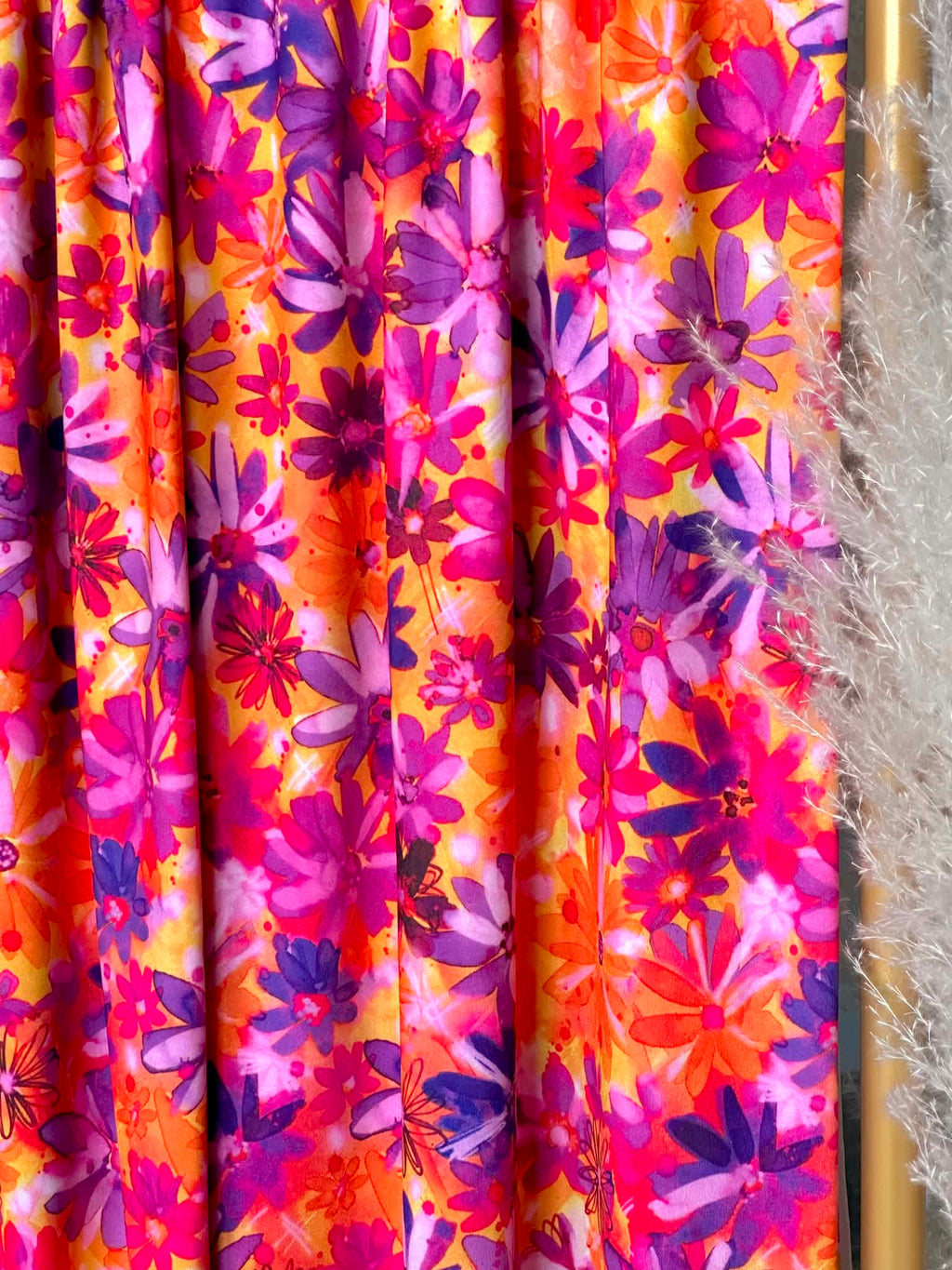 (ITY) PURPLE FLOWERS ON ORANGE