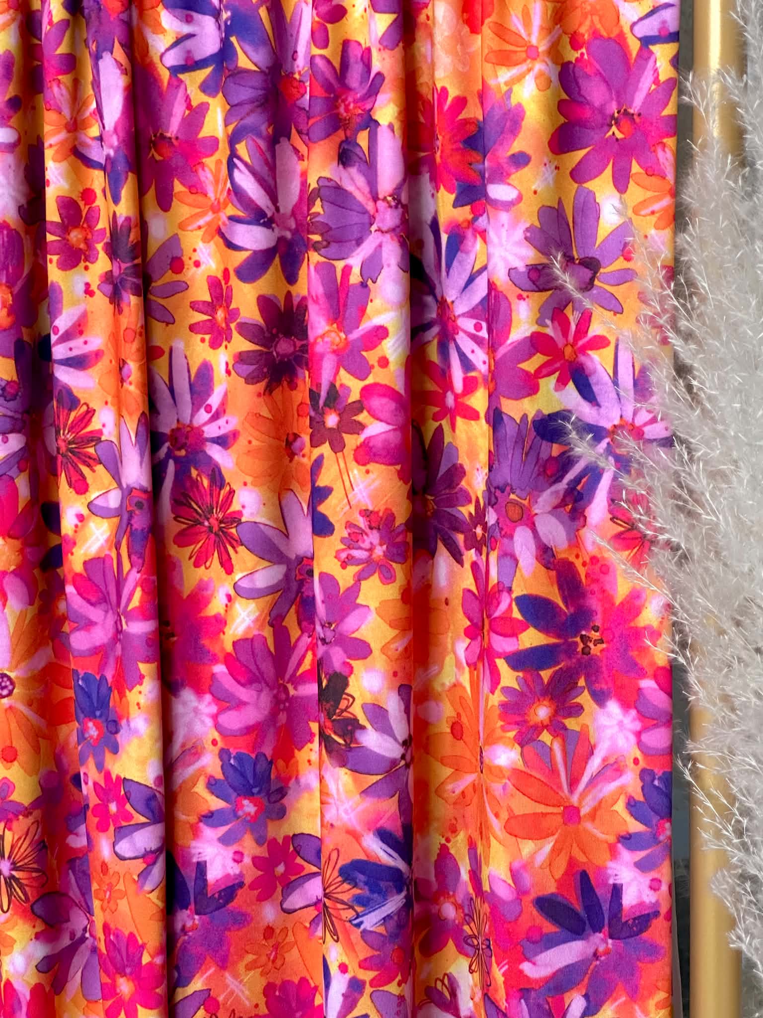 (ITY) PURPLE FLOWERS ON ORANGE