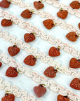 (TRIM) IVORY STRIP WITH VINTAGE HEART CHARMS