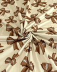 (DBP) FOOTBALL BOWS ON TAN