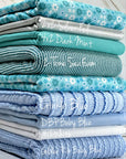 (POINTELLE RIB) BLUE AND OFF WHITE TINY FLOWERS ON OCEAN BLUE(1)