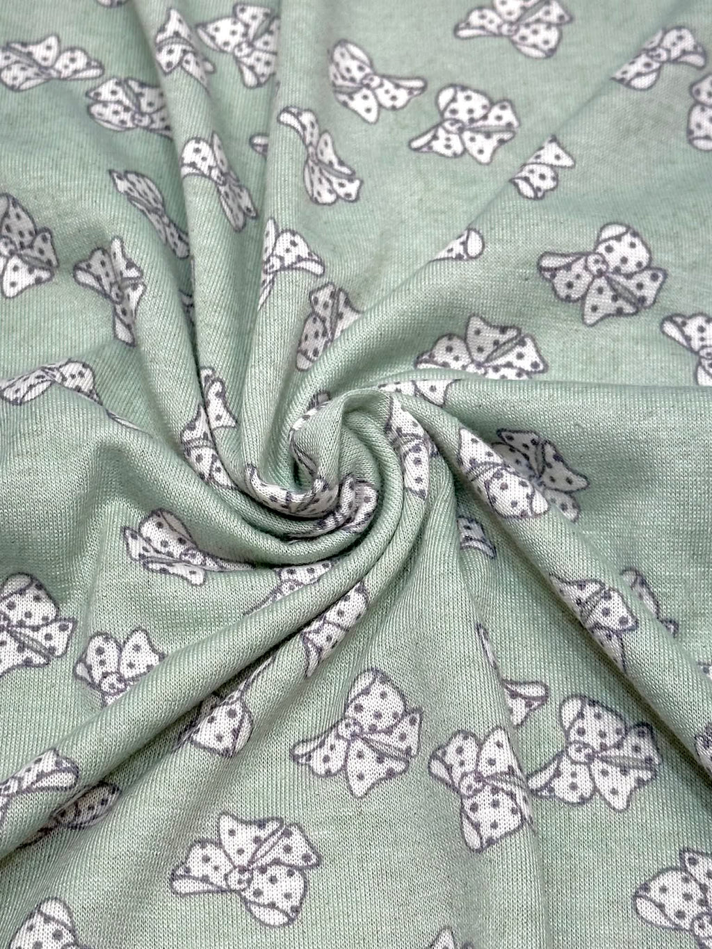 (KNIT) OFF WHITE POLKA DOT BOWS ON LIGHT SAGE