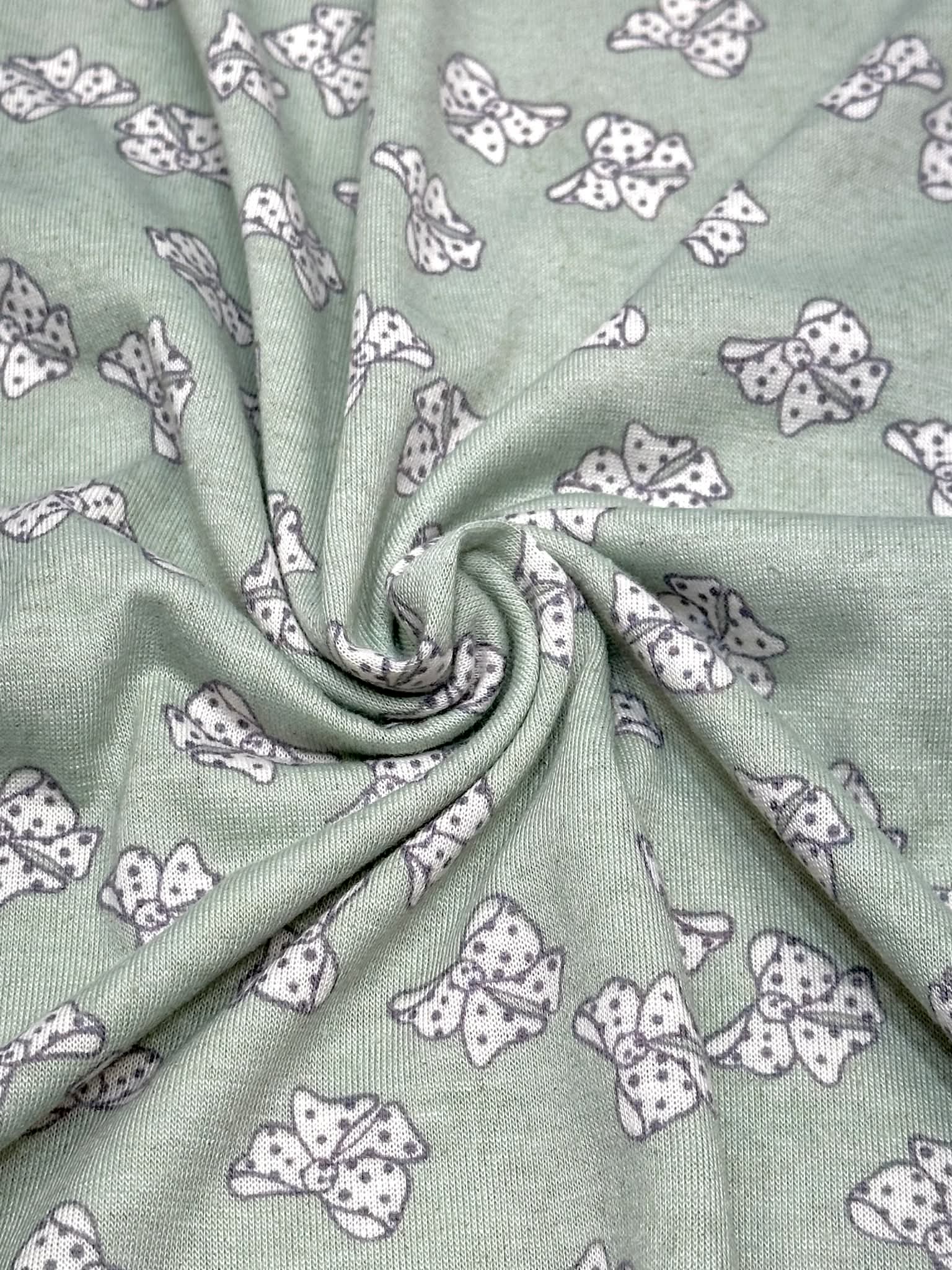 (KNIT) OFF WHITE POLKA DOT BOWS ON LIGHT SAGE