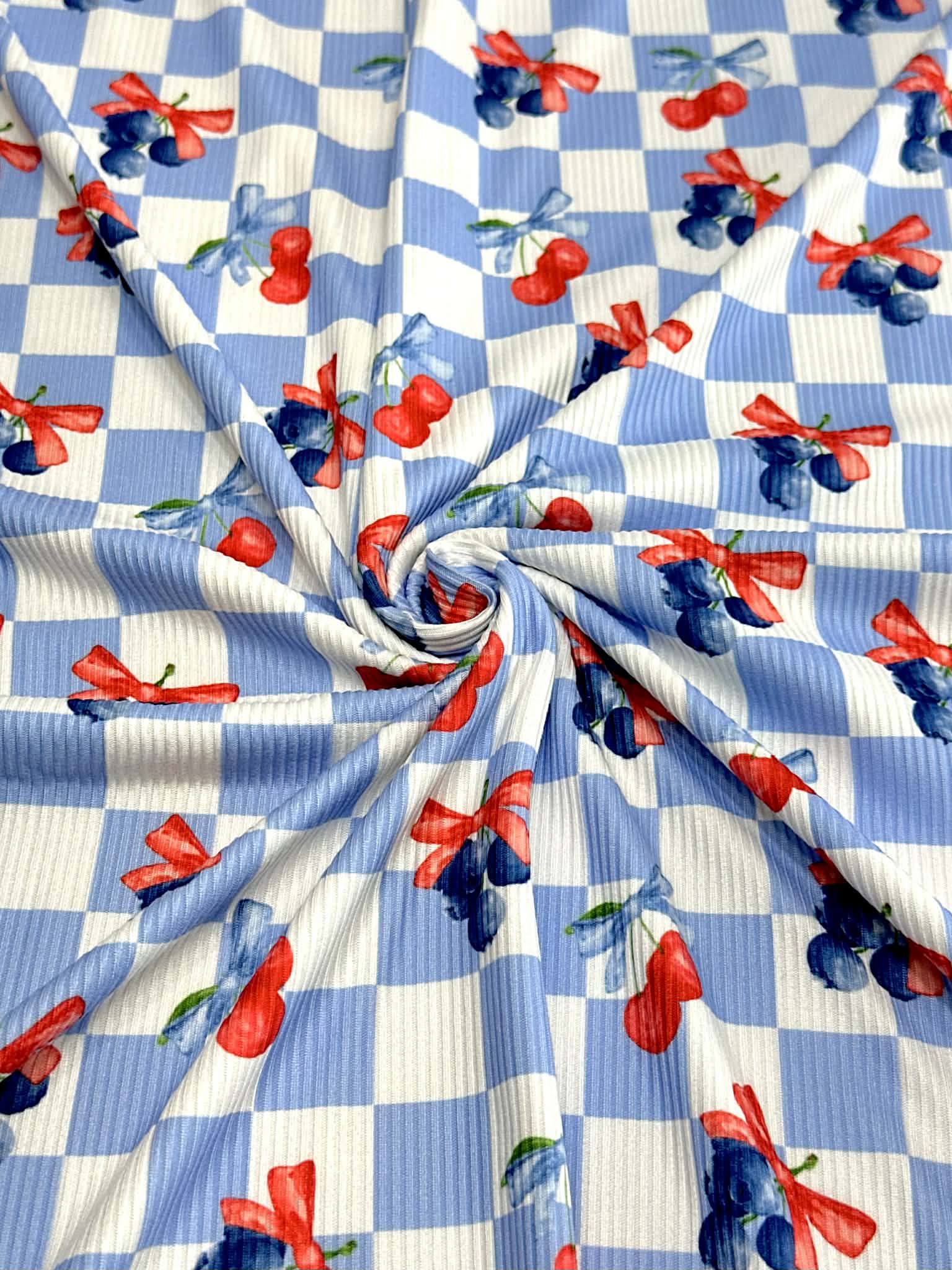 (2X2 YUMMY RIB) CHERRIES AND BLUEBERRIES WITH BOWS ON BLUE AND OFF WHITE CHECKERED