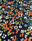 (HACCI SWEATER KNIT) ORANGE, GREEN, TEAL AND OFF WHITE LEOPARD ON NAVY