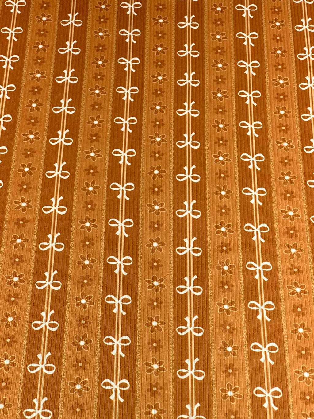 (4X2 RIB) FLOWER AND OFF WHITE BOWS PATTERN ON APRICOT