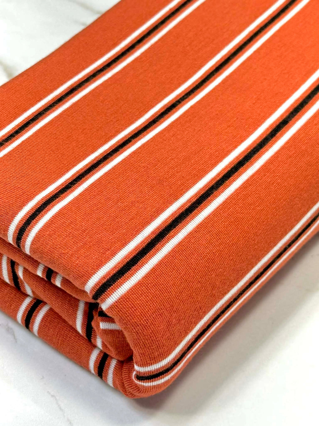 (RAYON MODAL) BLACK AND OFF WHITE STRIPES ON DARK ORANGE (3)