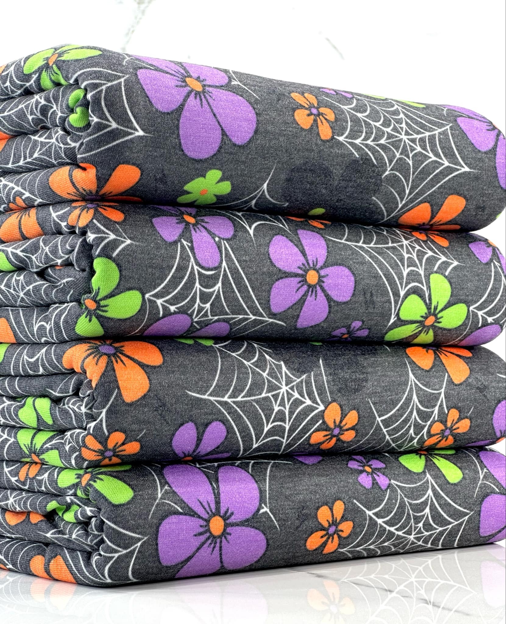 (FRENCH TERRY) SMALL COLORFUL FLOWERS & SPIDERWEBS ON CHARCOAL