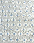 (TRIM) EMBROIDERED WHITE FLOWERS WITH LIGHT BLUE