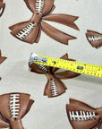 (DBP) FOOTBALL BOWS ON TAN