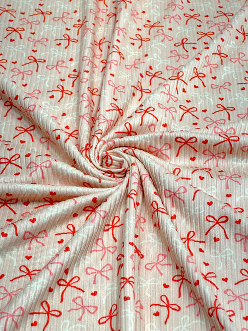 (4X2 YUMMY RIB) RED, PINK, AND IVORY BOWS WITH TINY HEARTS ON LIGHT BLUSH (3)
