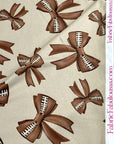 (DBP) FOOTBALL BOWS ON TAN
