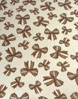 (DBP) FOOTBALL BOWS ON TAN