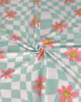 (FRENCH TERRY) LIGHT AQUA CHECKERED WAVE AND PINK HAPPY FACE FLOWERS