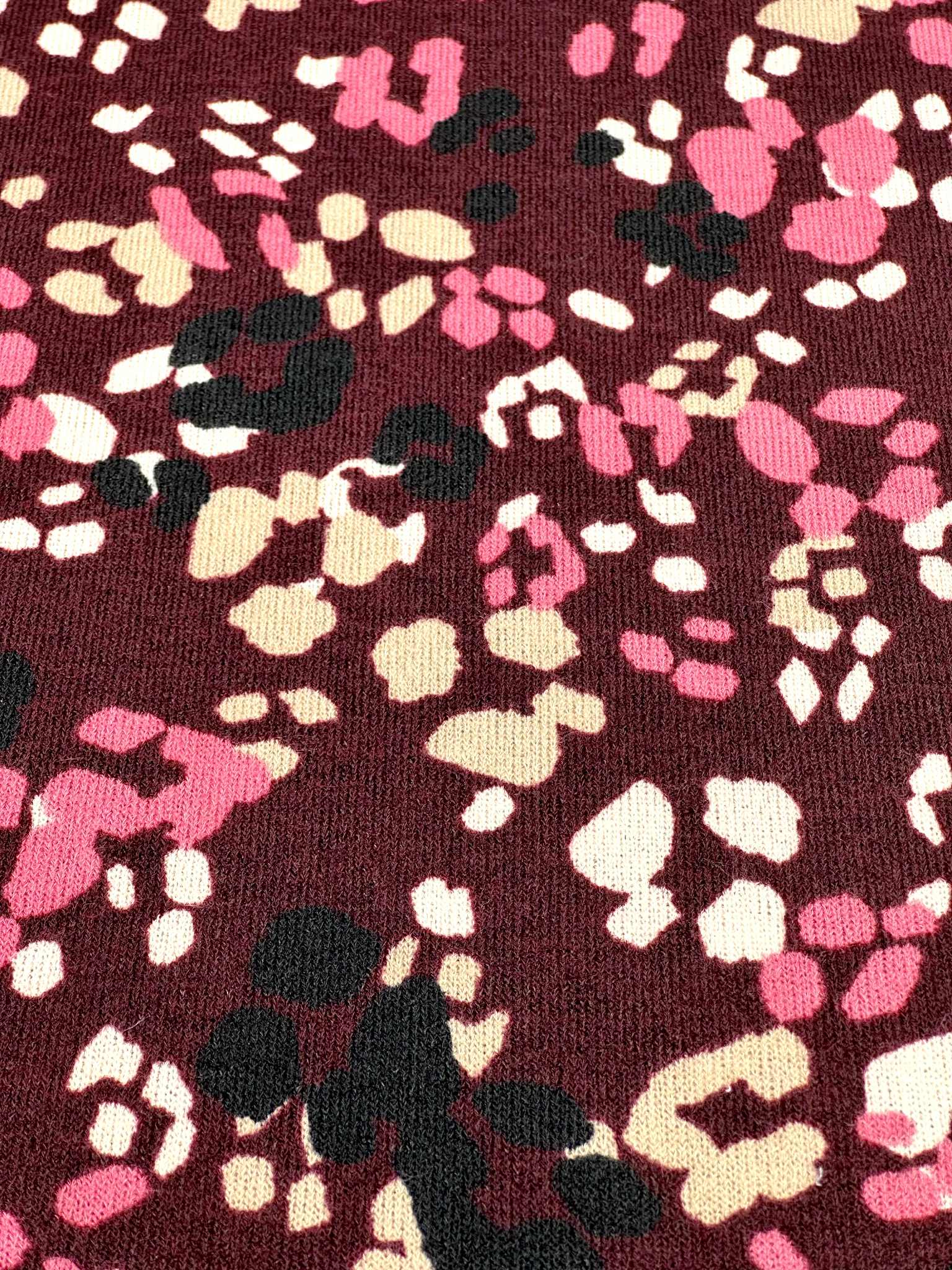 (HACCI SWEATER KNIT) PINK, IVORY, AND BLACK LEOPARD ON BURGUNDY