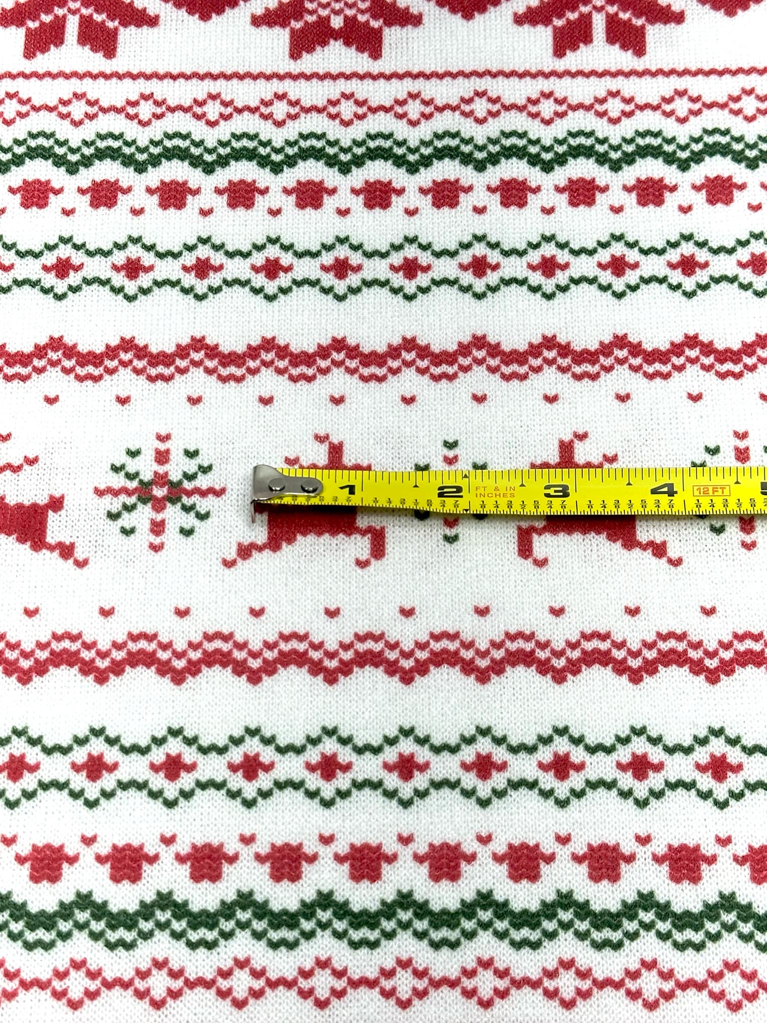 (SWEATER KNIT) RED REINDEERS AND RED POINSETTIA'S ON OFF WHITE
