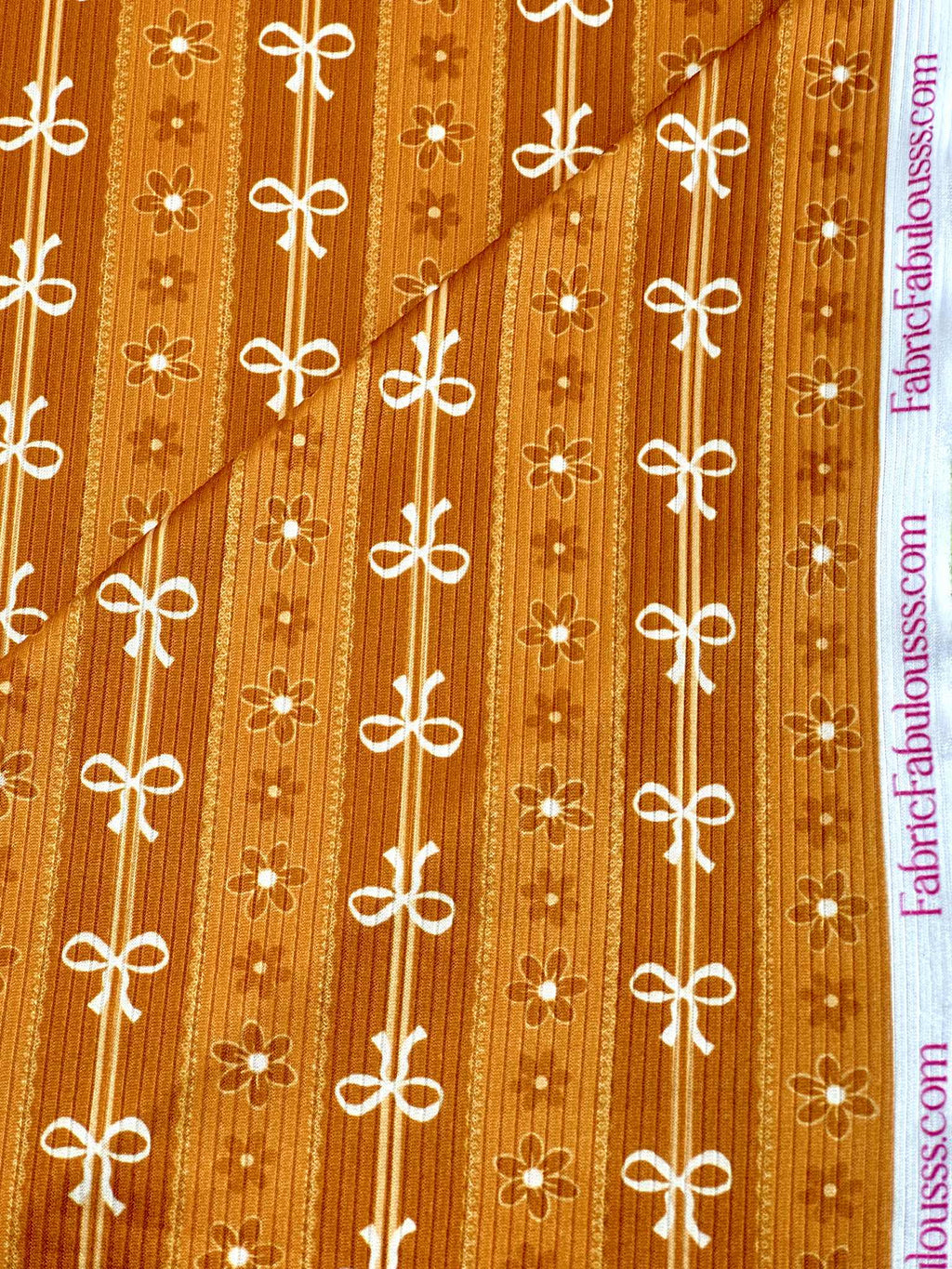 (4X2 RIB) FLOWER AND OFF WHITE BOWS PATTERN ON APRICOT