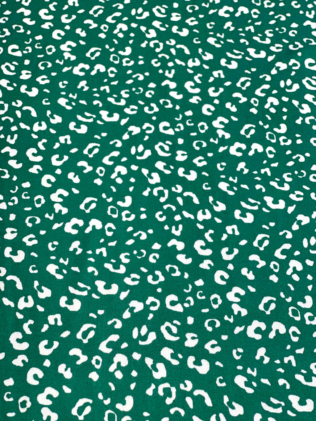 (DBP) TINY WHITE LEOPARD ON HUNTER GREEN