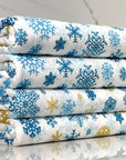 (DBP) BLUE AND GOLD SNOWFLAKES ON OFF WHITE