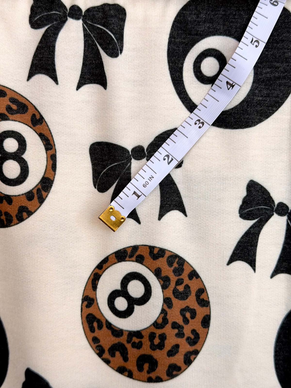 (FRENCH TERRY) BLACK BOW  AND LEOPARD 8-BALL PRINT ON CREAM