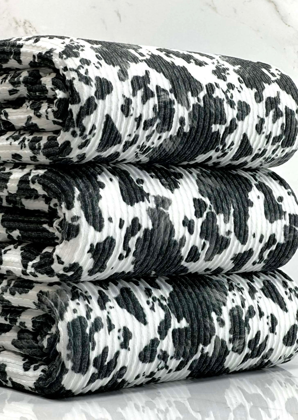 (URBAN RIB) SMALL BLACK COW FUR PRINT ON OFF WHITE