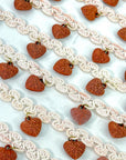 (TRIM) IVORY STRIP WITH VINTAGE HEART CHARMS