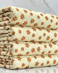 (THERMAL) TINY BURNT ORANGE FLOWERS ON CREAM