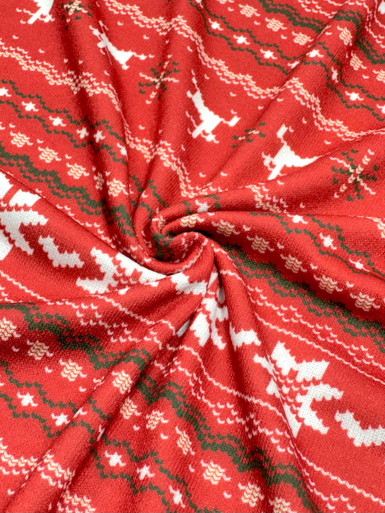 (SWEATER KNIT) OFF WHITE REINDEERS AND OFF WHITE POINSETTIA'S ON RED