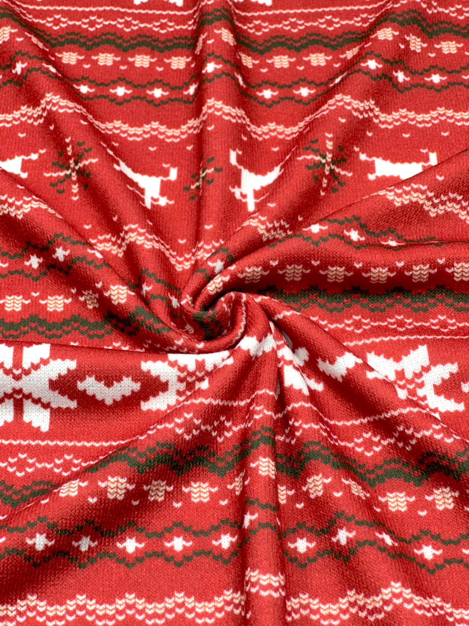 (SWEATER KNIT) OFF WHITE REINDEERS AND OFF WHITE POINSETTIA'S ON RED