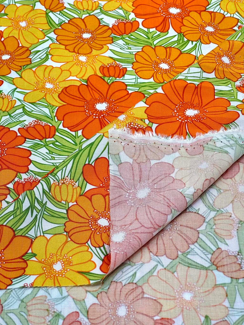 (WOVEN) ORANGE AND TANGERINE FLOWERS ON OFF WHITE
