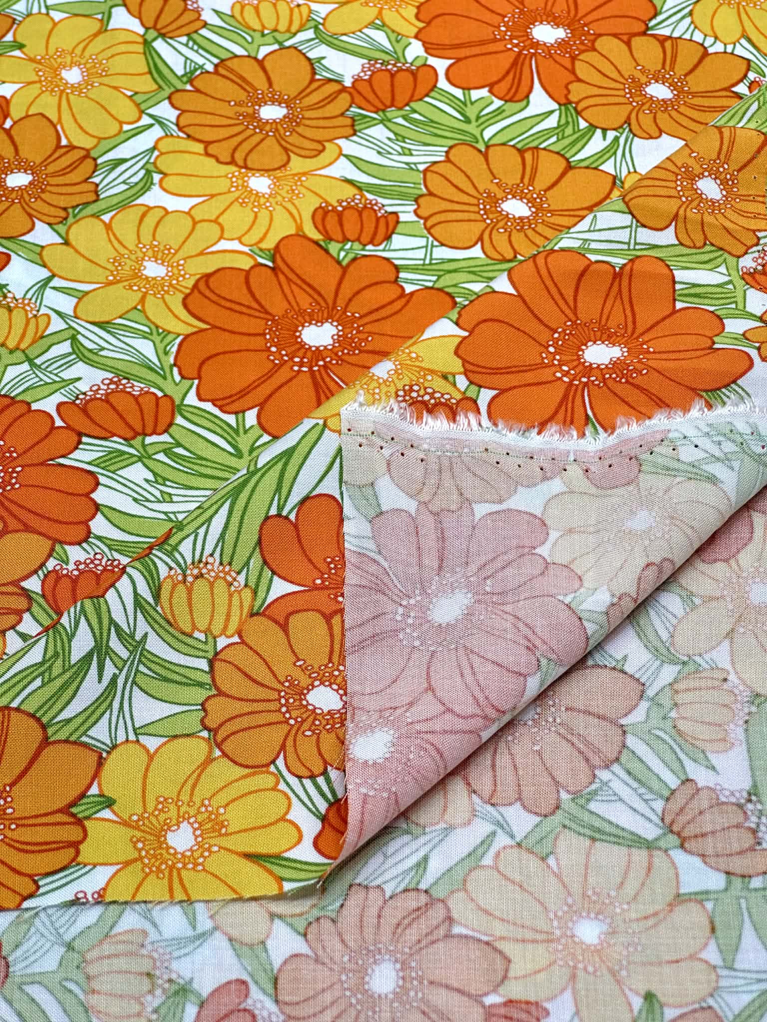 (WOVEN) ORANGE AND TANGERINE FLOWERS ON OFF WHITE