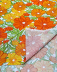 (WOVEN) ORANGE AND TANGERINE FLOWERS ON OFF WHITE