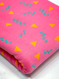 (HEAVY FRENCH TERRY) ORANGE TRIANGLES AND TURQUOISE SQUIGGLY ON PINK (1)