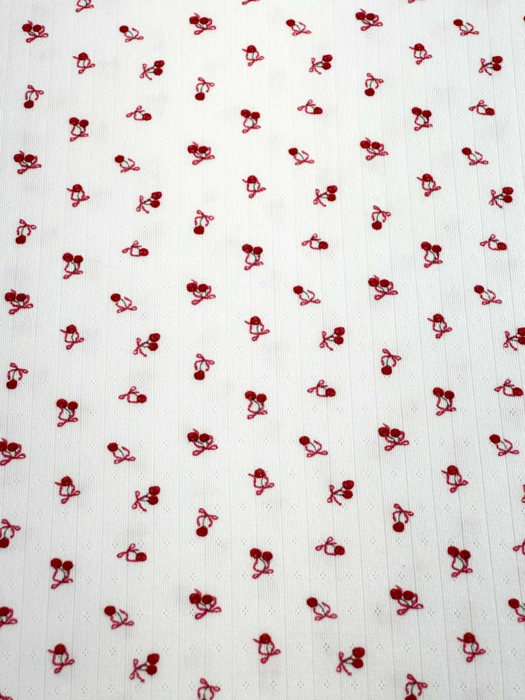 (POINTELLE RIB) TINY RED CHERRIES WITH BOWS ON OFF WHITE
